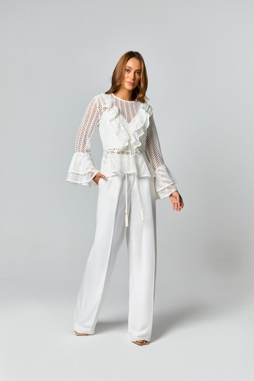 CALCA PANTALONA COM DETALHE CADARCO COBERTO COM POMPOM