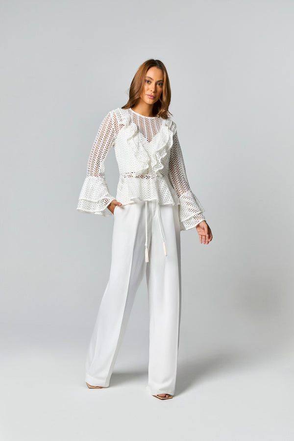 CALCA PANTALONA COM DETALHE CADARCO COBERTO COM POMPOM